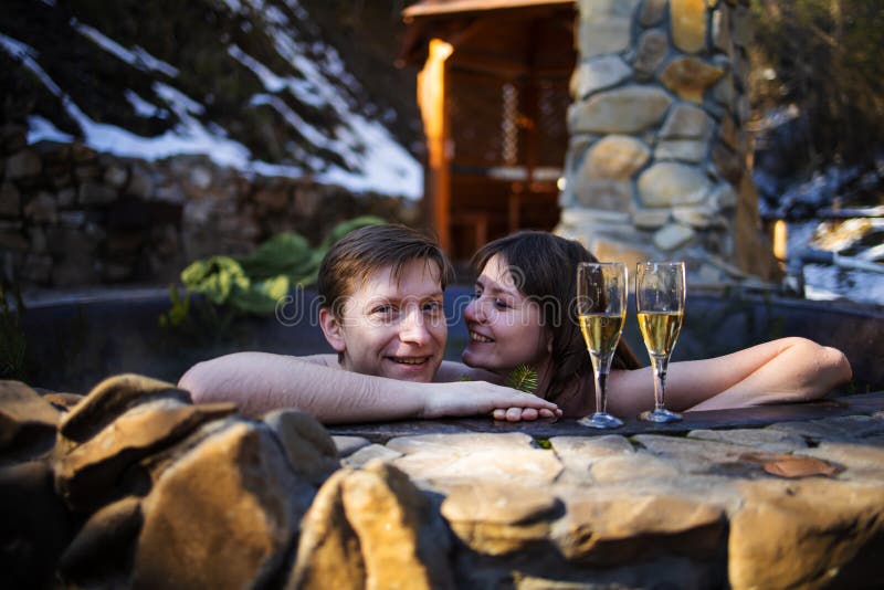 Couple Relaxing With Champagne In Hot Tub Jacuzzi Outdoor Honeymoon 