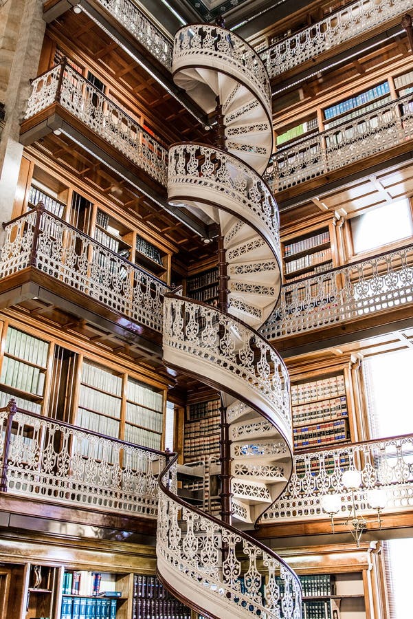 Law Library Inside the Des Moines Iowa State Capital building with ornate architecture and spiral staircase with several stories high of books. Law Library Inside the Des Moines Iowa State Capital building with ornate architecture and spiral staircase with several stories high of books.