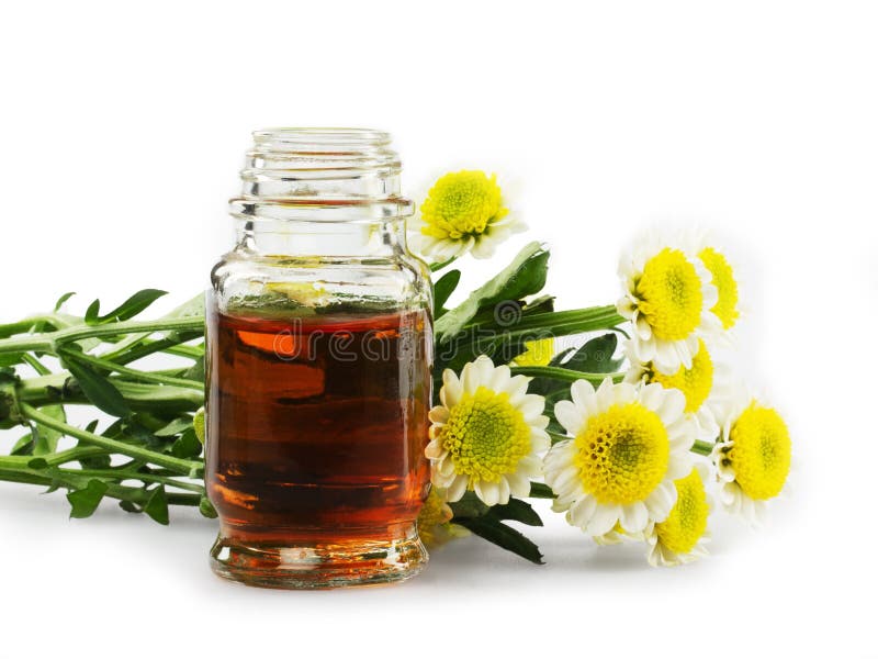 Wesentliche Schmieröle und Blumen lizenzfreie stockfotografie Wesentliche Schmieröle und Blumen lizenzfreie stockfotografie