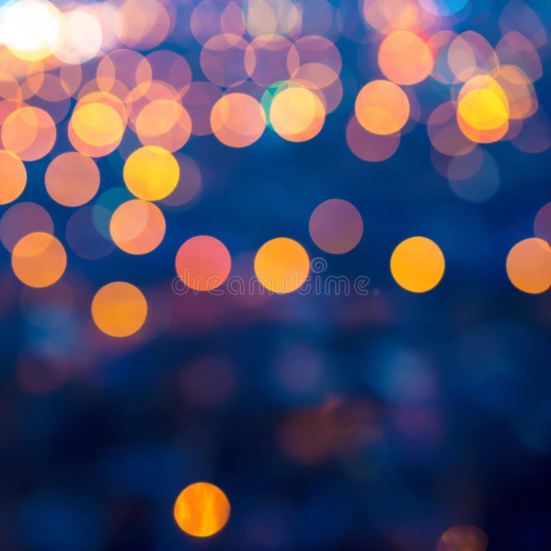 Wesoło bożonarodzeniowe światła abstrakcjonistyczny kółkowy bokeh na błękitnym backgroun obraz royalty free