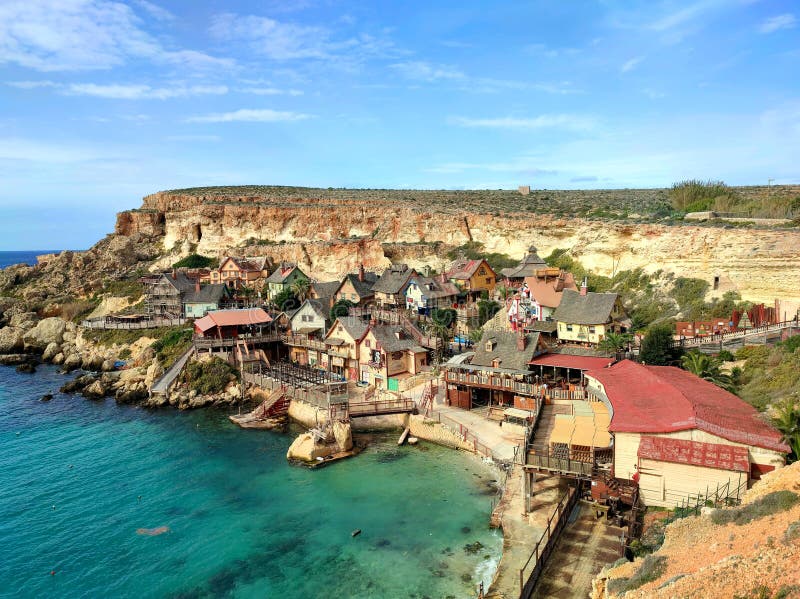 Popeye Village, aka Sweethaven Village, is a purpose-built film set village for the eponymous 1980 film by Robert Altman, starring Robin Williams and Shelley Duvall, that has been converted into a small attraction fun park, consisting of a collection of rustic and ramshackle wooden buildings at Prajjet Bay Anchor Bay, 3 km (2 mi) from the village core of Mellieha, Malta. December 3, 2023. Popeye Village, aka Sweethaven Village, is a purpose-built film set village for the eponymous 1980 film by Robert Altman, starring Robin Williams and Shelley Duvall, that has been converted into a small attraction fun park, consisting of a collection of rustic and ramshackle wooden buildings at Prajjet Bay Anchor Bay, 3 km (2 mi) from the village core of Mellieha, Malta. December 3, 2023