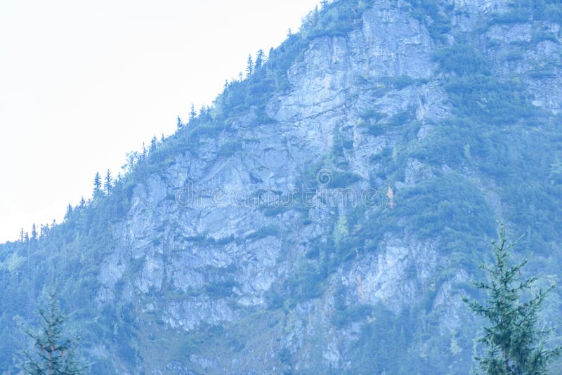 Mountain tops in autumn covered in mist or clouds