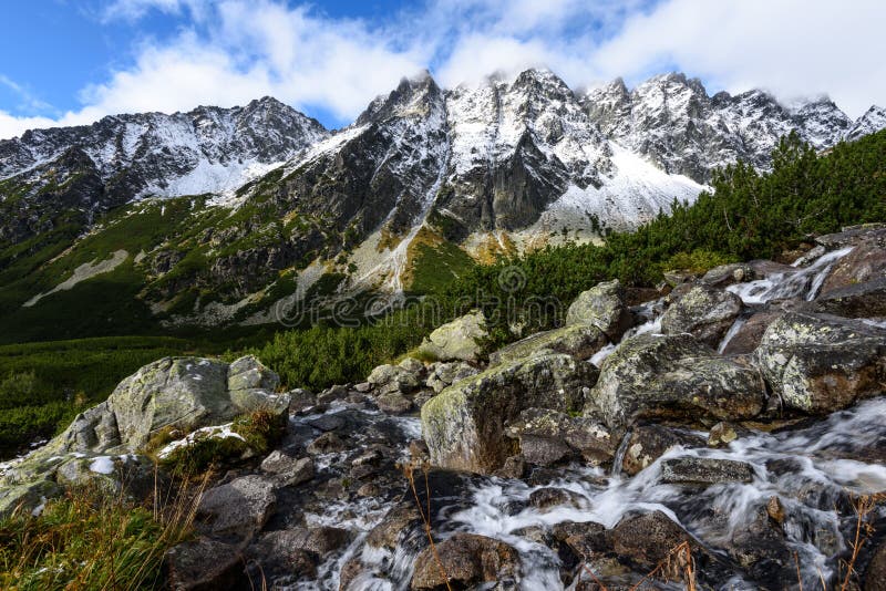 Mountain tops in autumn covered in mist or clouds