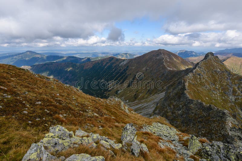 Mountain tops in autumn covered in mist or clouds