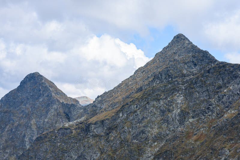 Mountain tops in autumn covered in mist or clouds