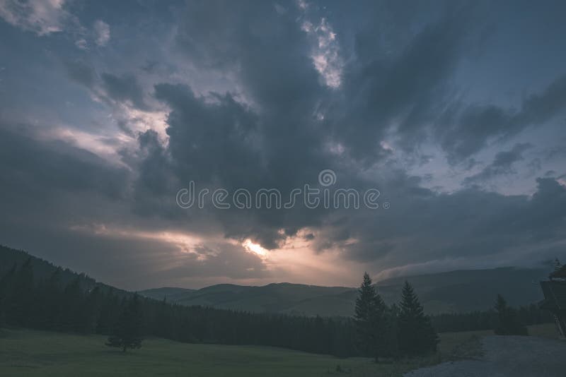 Western carpathian Tatra mountain skyline with green fields and forests in foreground. summer in Slovakian hiking trails - vintage