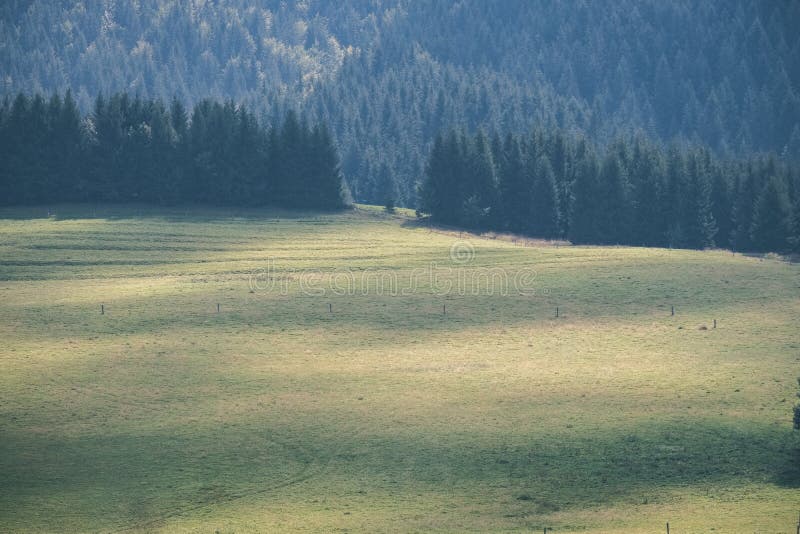 Western carpathian Tatra mountain skyline with green fields and forests in foreground. summer in Slovakian hiking trails - vintage