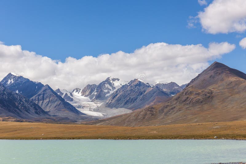 Western Mongolia mountainous landscape. View at Tsaagan Gol River, White River. Altai Tavan Bogd National Park, Bayan-Ulgii