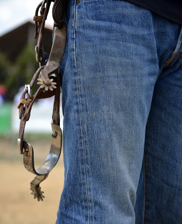 Western riding spurs hanging on belt stock images Western riding spurs hanging on belt stock images