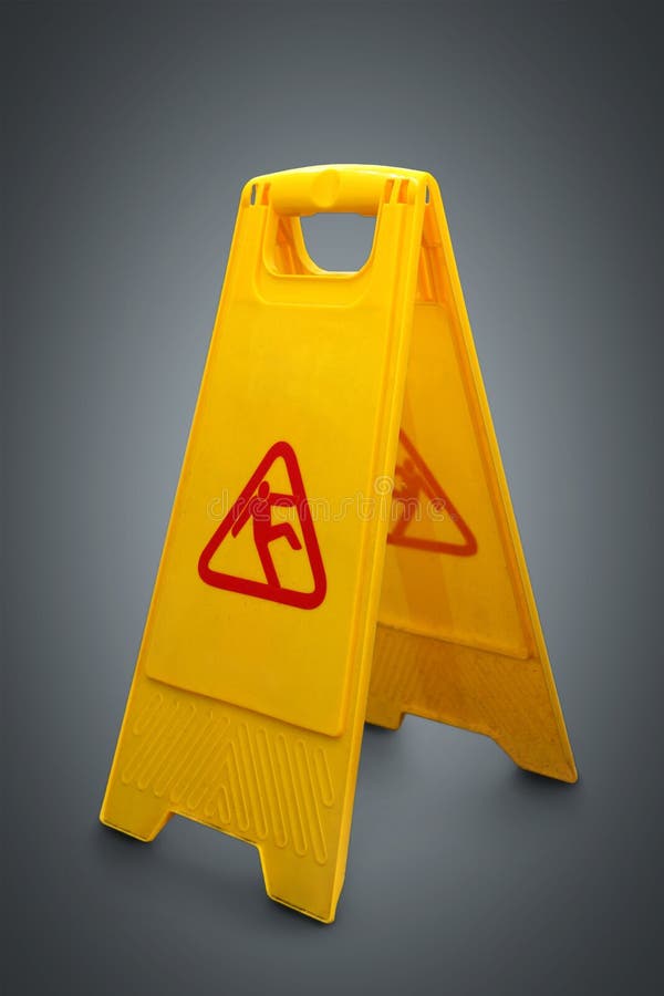 Wet floor sign on grey stock photos Wet floor sign on grey stock photos