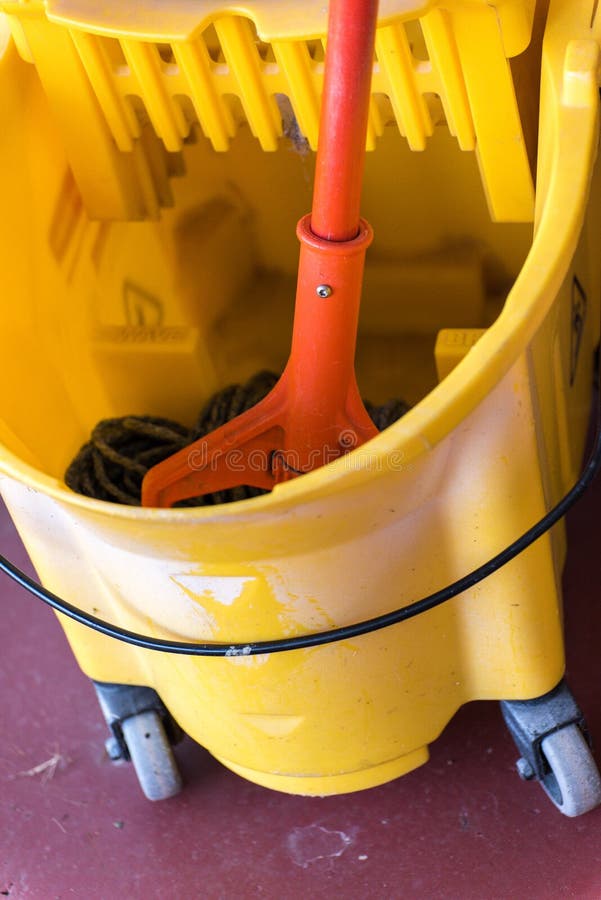 Wet Mop in a Dry Mop Bucket Stock Photo Image of orange, yellow 61156754