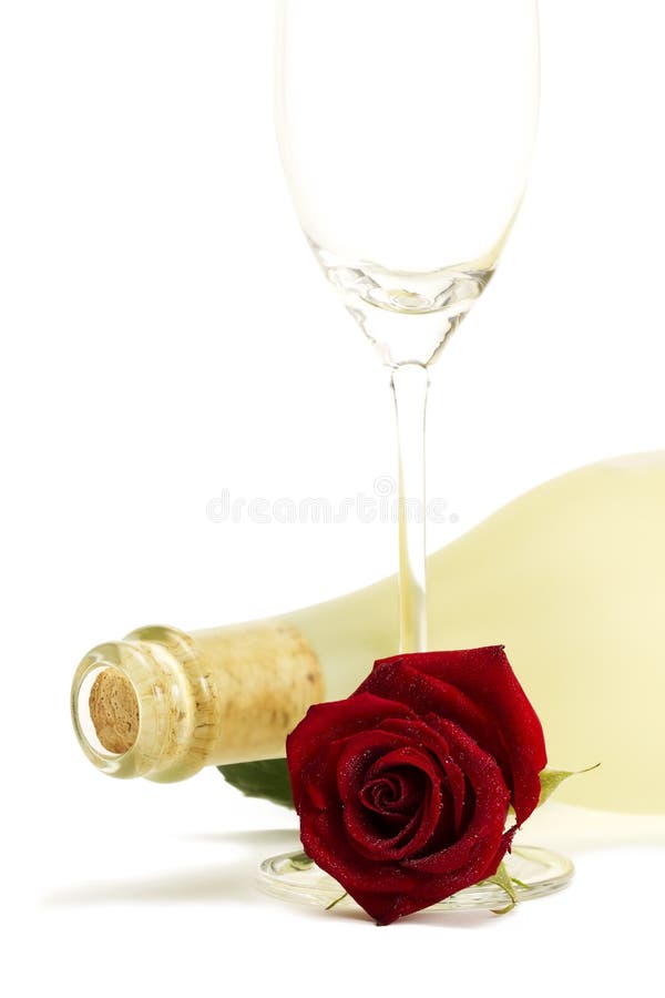 Wet red rose with a dull prosecco bottle and a emp