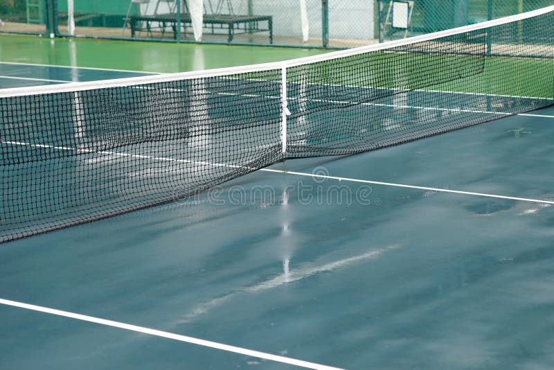 Wet tennis court stock photo. Image of leisure, rain 61391872