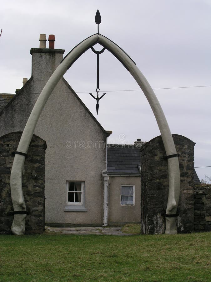 Jaw bones fixed into an arch embellish the entrance to a church yard On the Isle of Lewis. This would have been a whaling community before the trade finished. Harpoon tips decorate the arch. Jaw bones fixed into an arch embellish the entrance to a church yard On the Isle of Lewis. This would have been a whaling community before the trade finished. Harpoon tips decorate the arch.