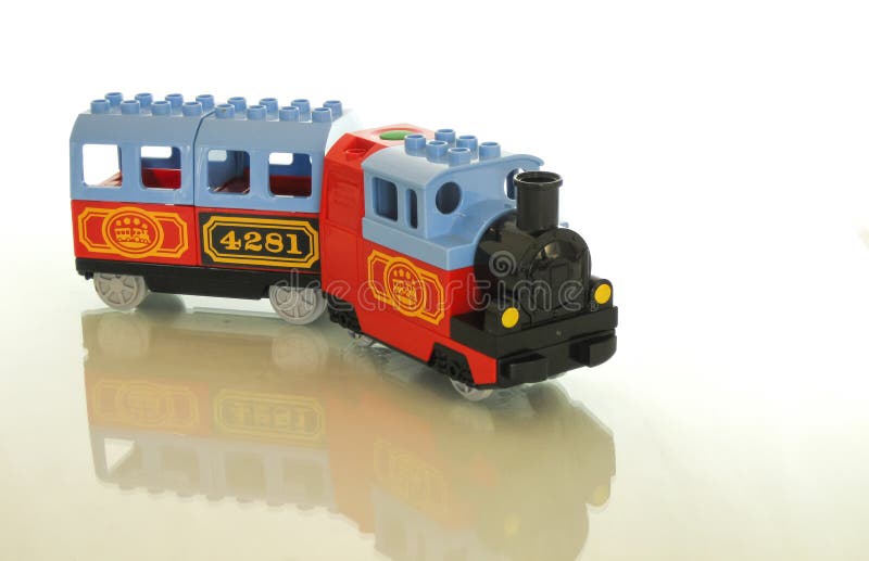 Designer and train - a great combination for a toy. stock photos Designer and train - a great combination for a toy. stock photos