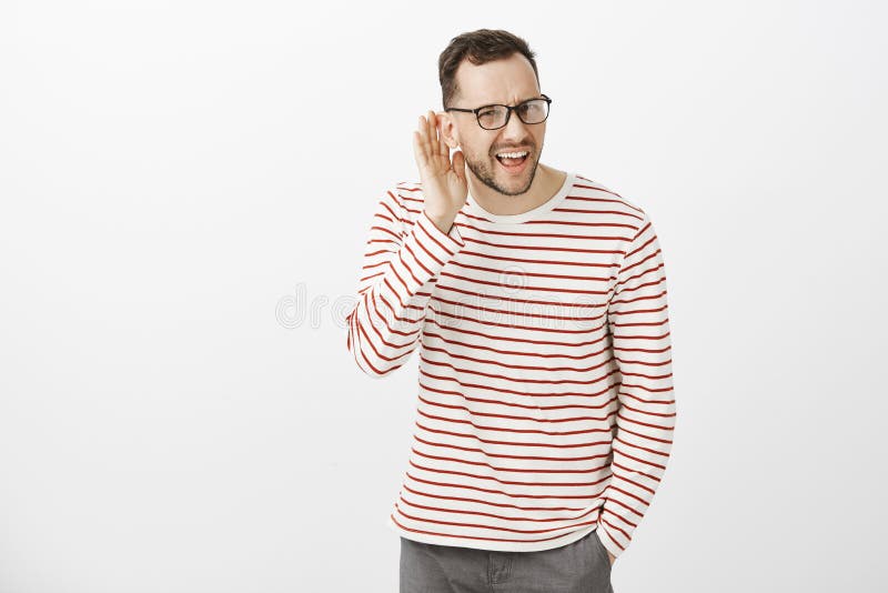 What did you say, repeat. Portrait of annoyed questioned attractive european guy in black glasses, asking question and stock images What did you say, repeat. Portrait of annoyed questioned attractive european guy in black glasses, asking question and stock images