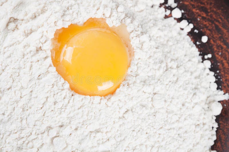 Wheat flour and egg yolk stock photo. Image of yellow 71722446