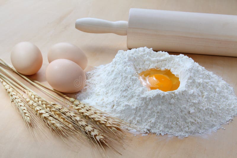 Wheat, flour and eggs stock image. Image of heap, flour 23498261