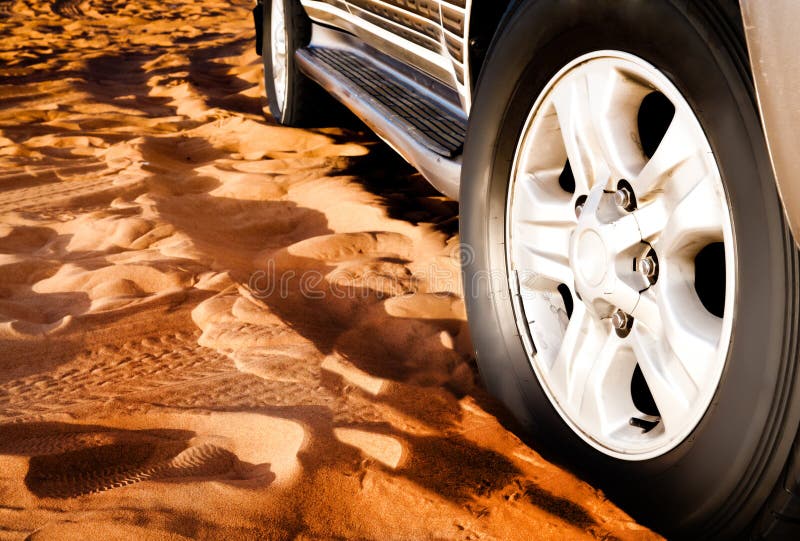 Wheel of a car on the sand