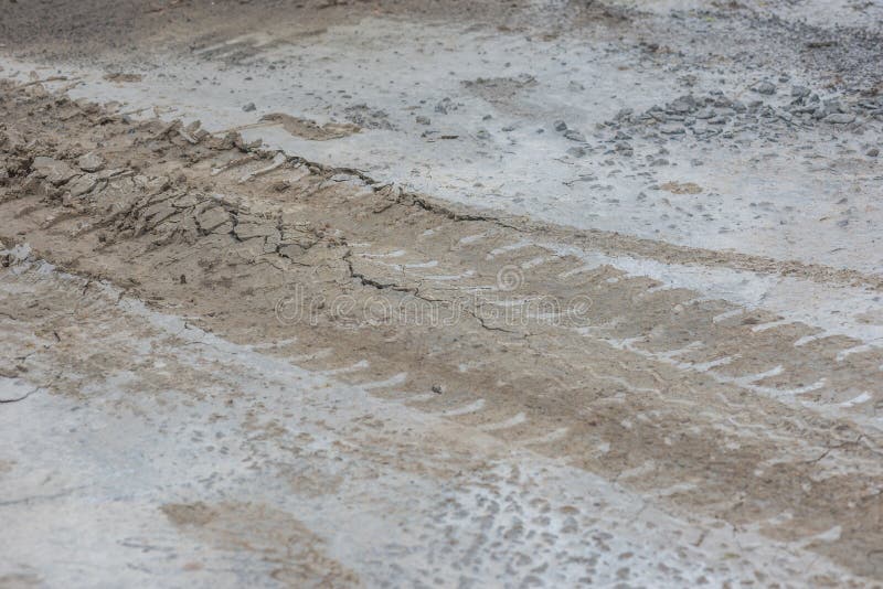 Wheel Car Track on Wet Cement Concrete Floor for Background Stock Image