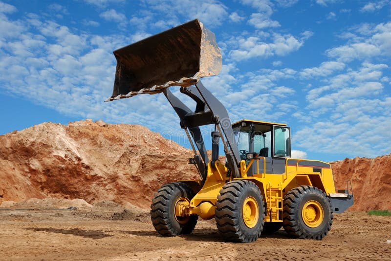 Wheel loader bulldozer in sandpit royalty free stock images