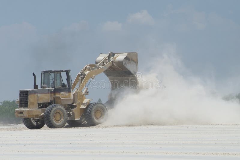 Wheel loader and dust royalty free stock photography