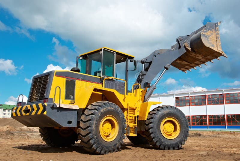 Wheel loader excavator at work stock image