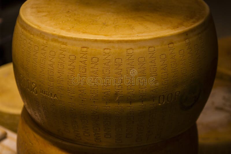 Wheel of Parmesan cheese stock photo. Image of wheel 71787974