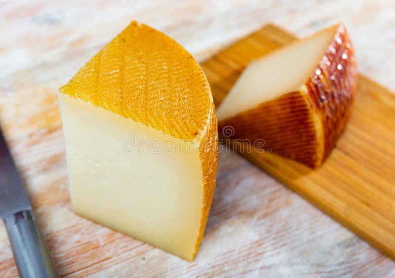 Wheel of Spanish with Cut Piece on Wooden Table Stock Photo Image of