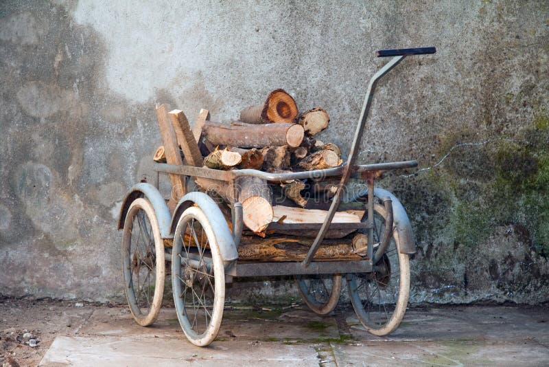 Wheelbarrow with a load of wood