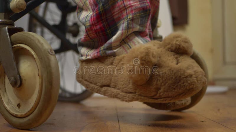 Wheelchair users in slippers and pyjamas stock video footage