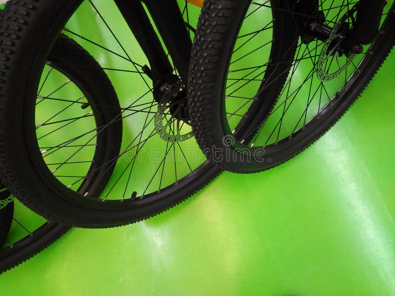 Wheeled Bicycle Parked on Green Ground,row of Bicycles Stock Image