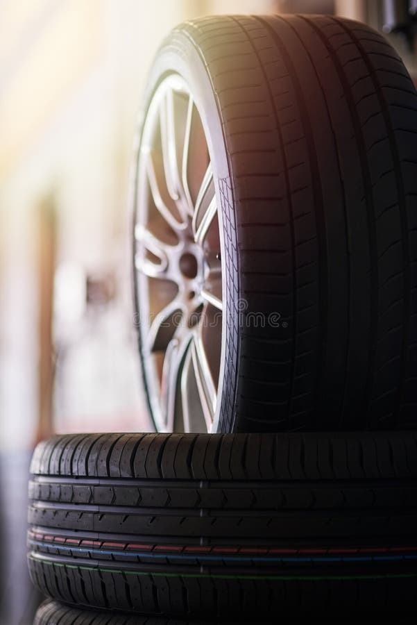 Wheels and Tyres. Closeup Shot of a Pile of Car Tyres. Stock Photo