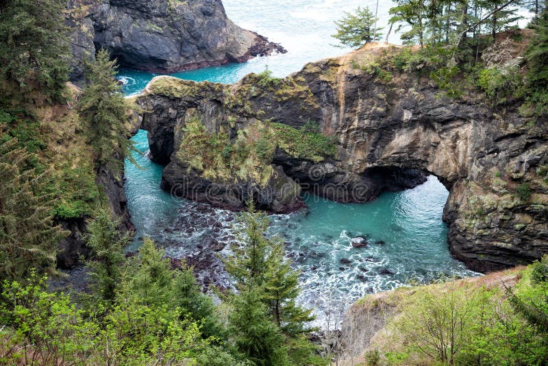 Where rocky coastline jut out into sea. Sea arches and coastal inlets. Rocky coast in Oregon, USA