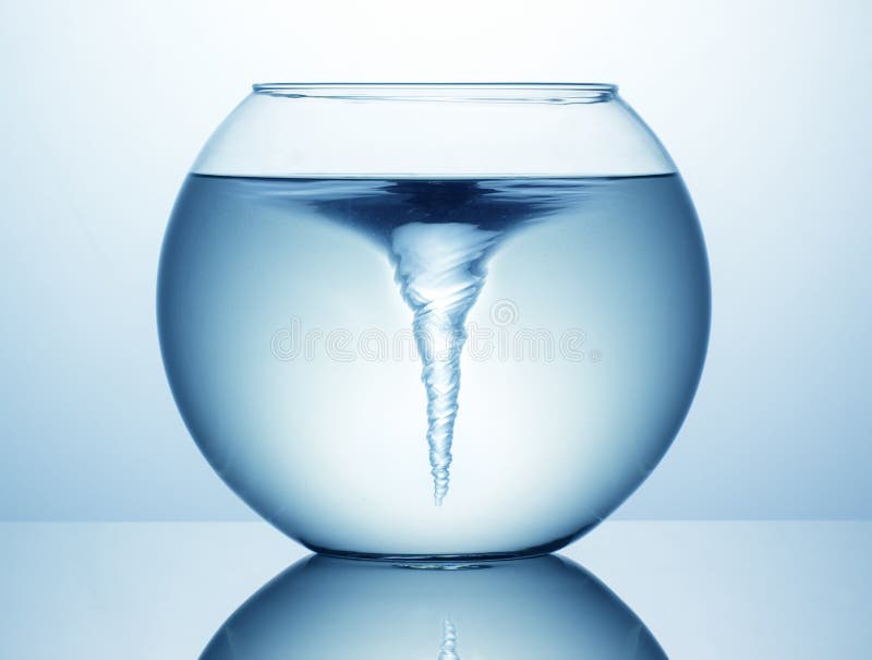 Blue water whirlpool in fish bowl. Whirlpool vortex water stock images, royalty-free photos and pictures