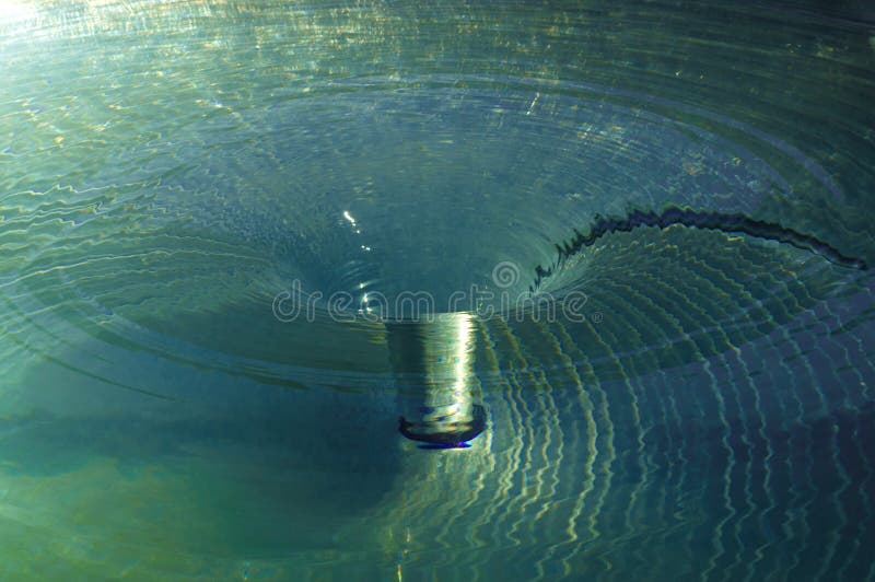 Water - Vortex - Whirlpool - Maelstrom Spinning underwater vortex against  white background Stock Photo