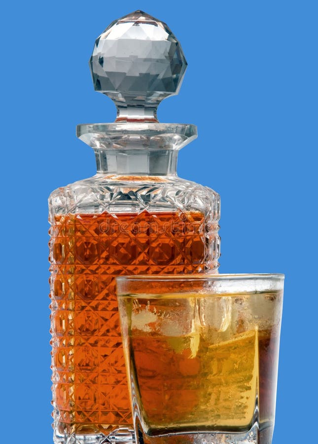 Whiskey and decanter with blue background