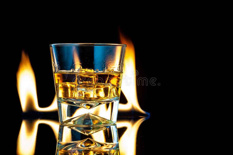 Whiskey or Bourbon in a Transparent Glass with Ice Cubes on a Black  Background with Fire Stock Image - Image of cube, liquor: 202917701