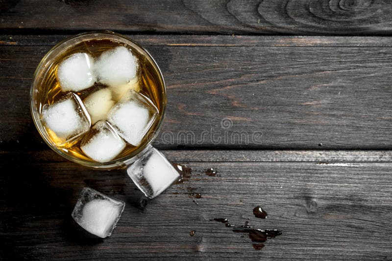 Whiskey in a glass with ice cubes