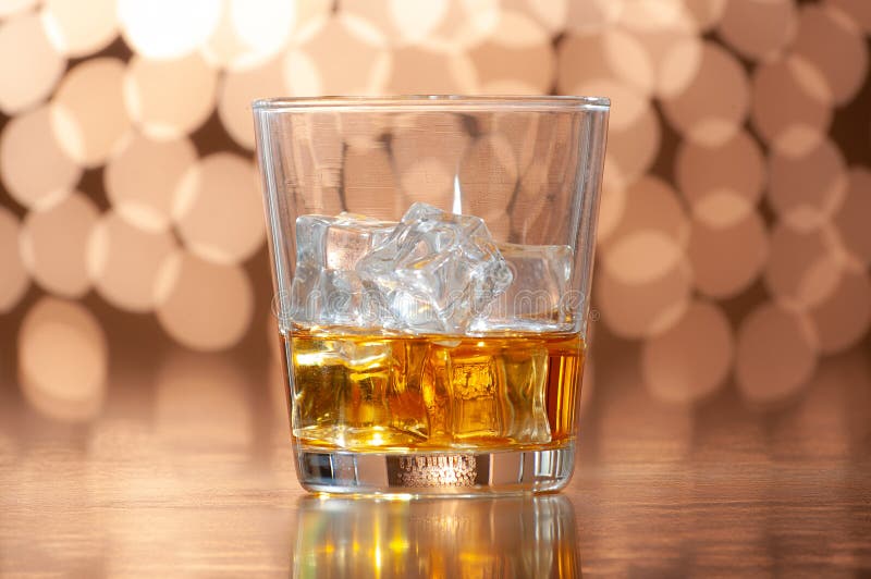 Whiskey on the rocks on bokeh back ground. Bokeh whiskey stock images, royalty-free photos and pictures