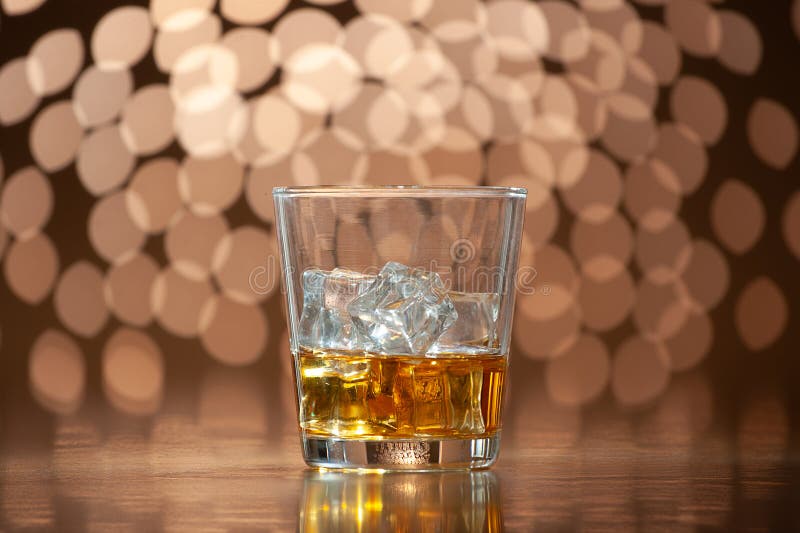 Whiskey on the rocks on bokeh back ground. Bokeh whiskey stock images, royalty-free photos and pictures