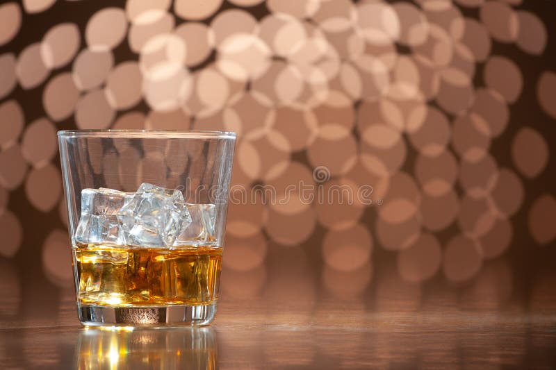 Whiskey on the rocks on bokeh back ground with copy space. Bokeh whiskey stock images, royalty-free photos and pictures