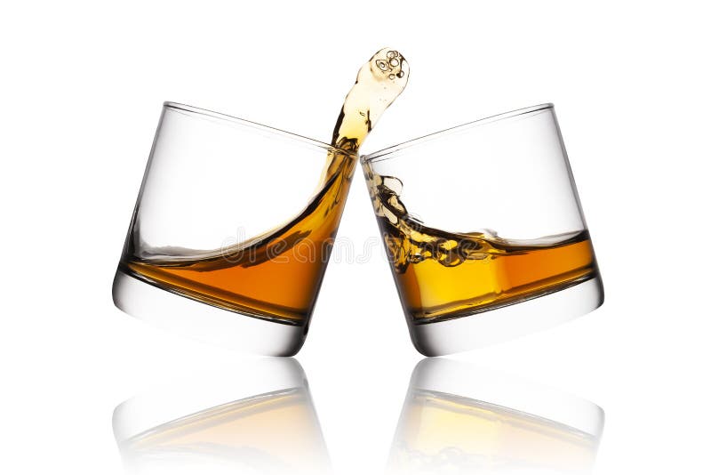 Splash of whisky in two glasses on white background