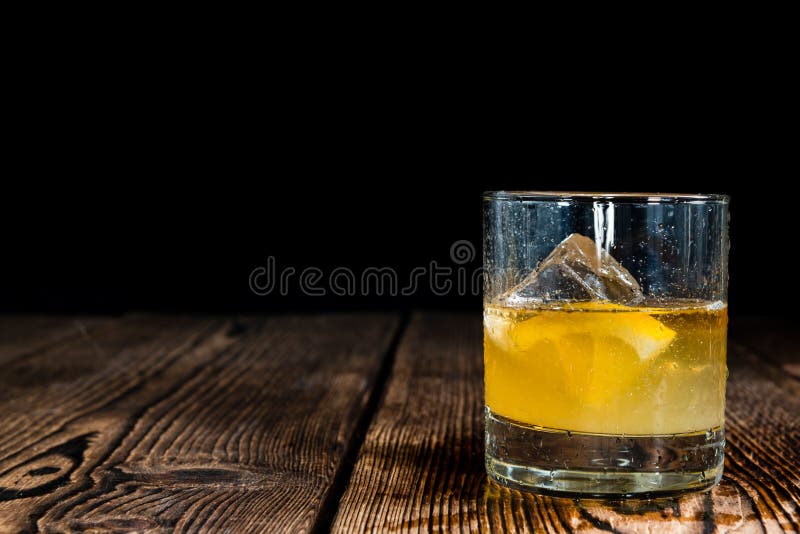 Whiskey Sour with ice cubes (close-up shot). Whiskey Sour with ice cubes (close-up shot)