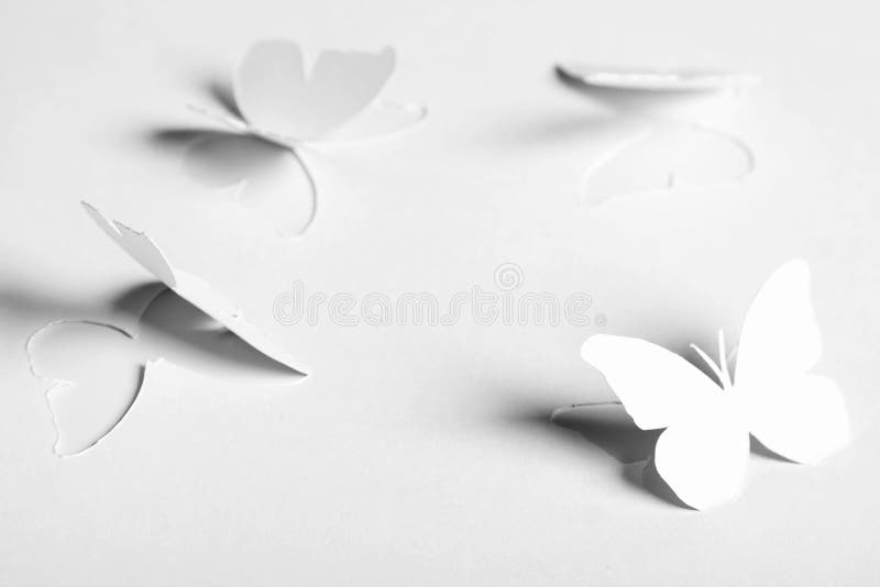 White abstract paper cutout butterflyes stock images