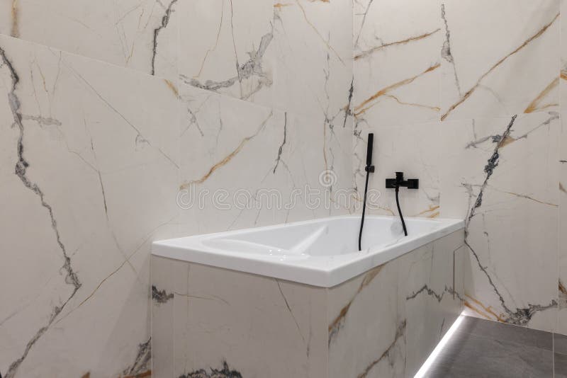 White Acrylic Bathtub in a Modern Interior of a New Apartment Stock