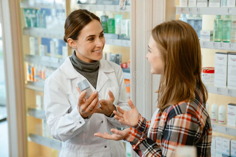 White Apothecary Wearing Lab Coat Working with Customer in Pharmacy Stock Photo Image of