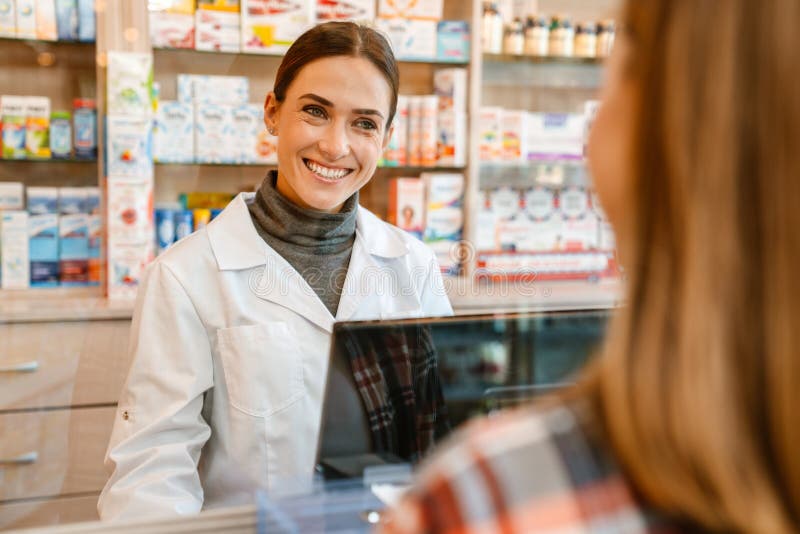 White Apothecary Wearing Lab Coat Working with Customer in Pharmacy ...