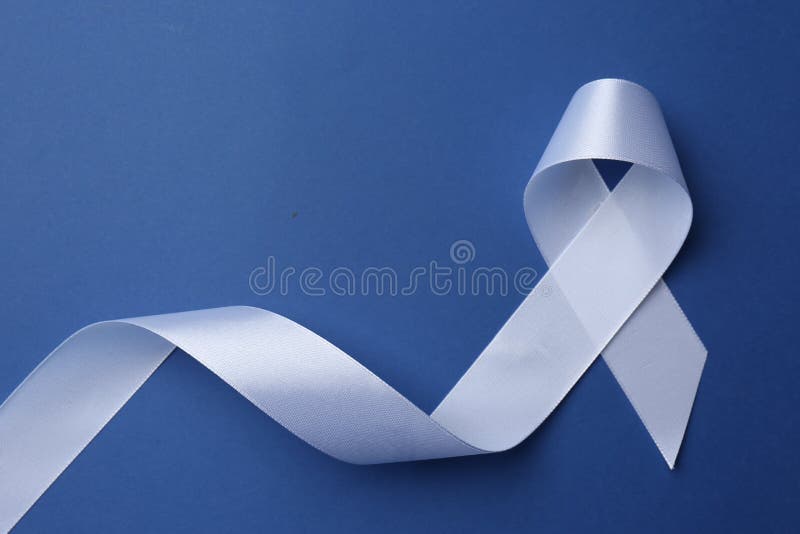 White Awareness Ribbon on Blue Background, Top View. Space for Text