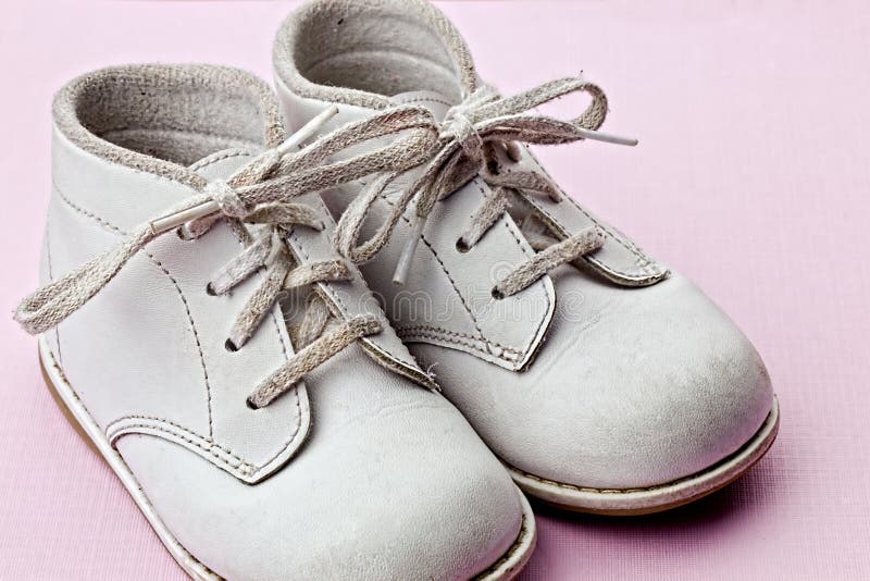 White baby shoes stock photo